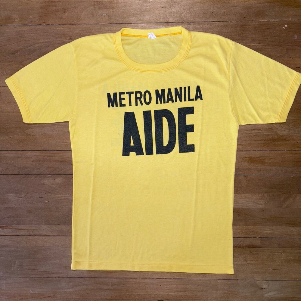 Vintage 80s Metro Manila Aide Band Shirt Single Stitch Yellow Graphic Tee SZ L